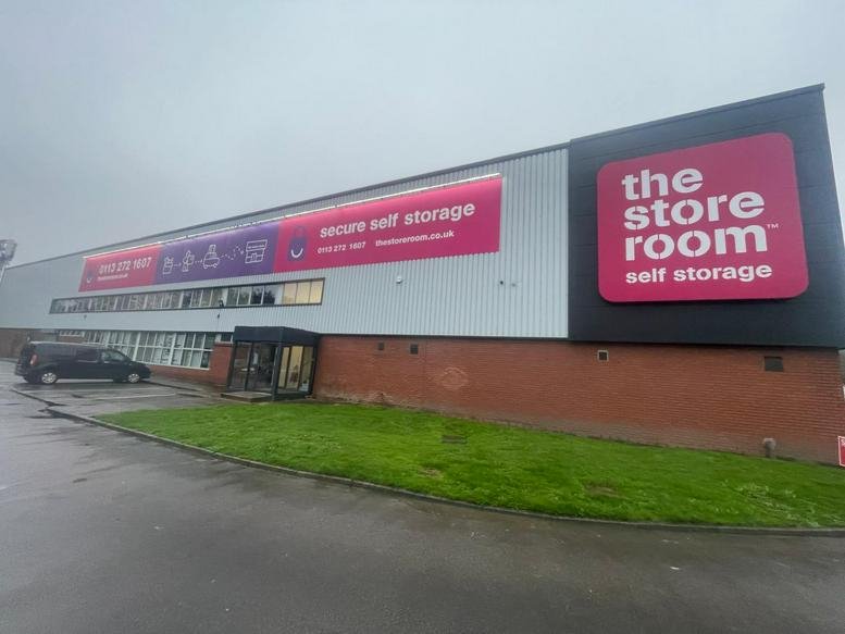 Exterior view of the Business Centre, A6110 Ring Road, Beeston featuring signage and a brick facade.