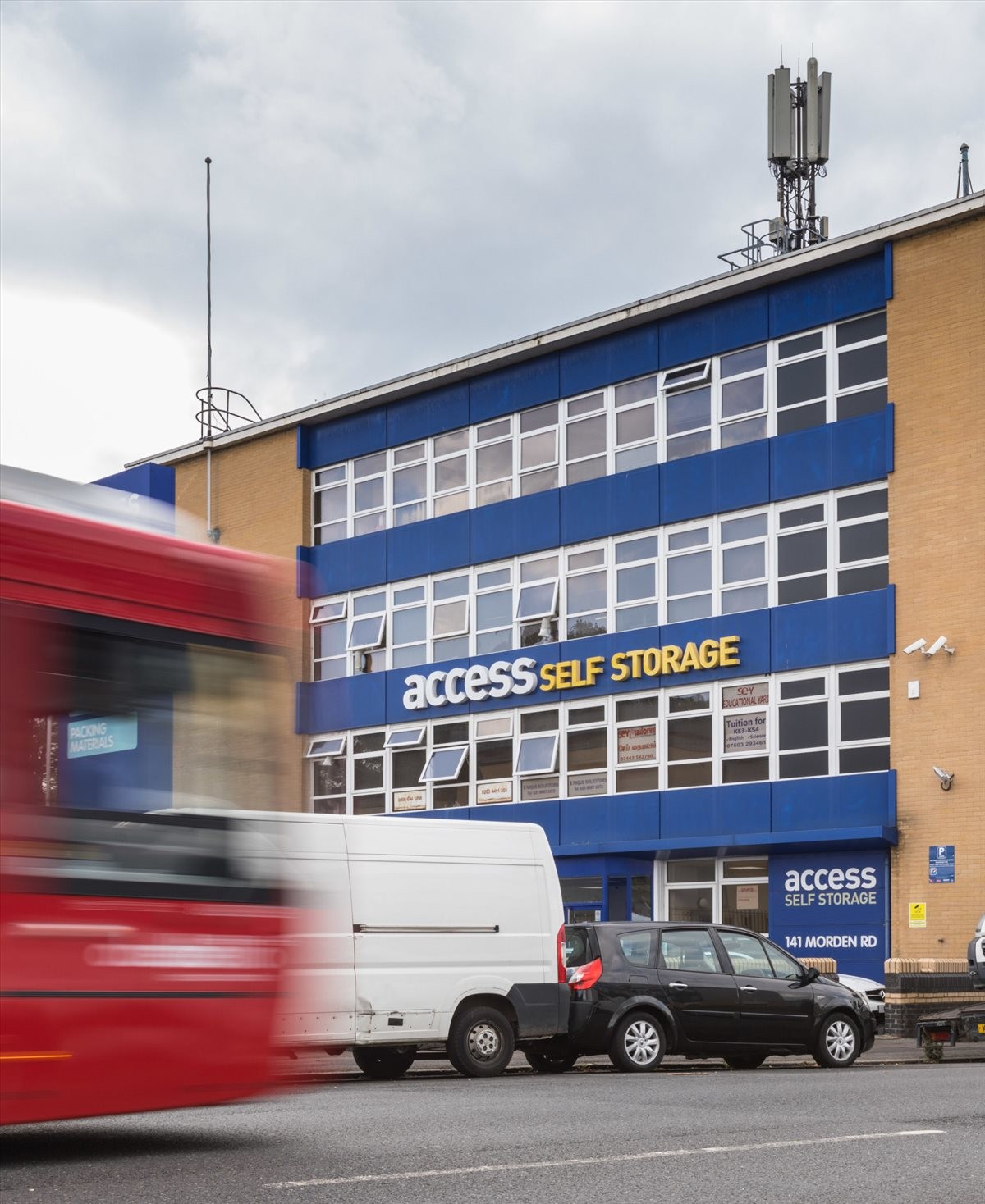Exterior view of Access House, 141 Morden Road, featuring a blue and tan facade.