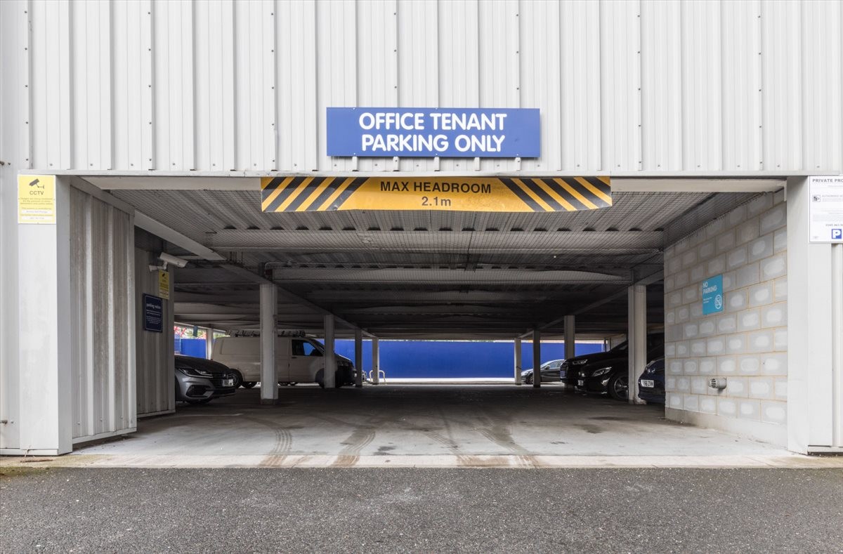Secure gated entrance to the tenant parking area at 141-157 Acre Lane.