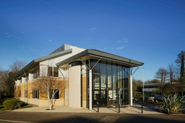 Exterior view of the modern glass and stone facade at Dixcart House, Bourne Business Park, Addlestone Road.