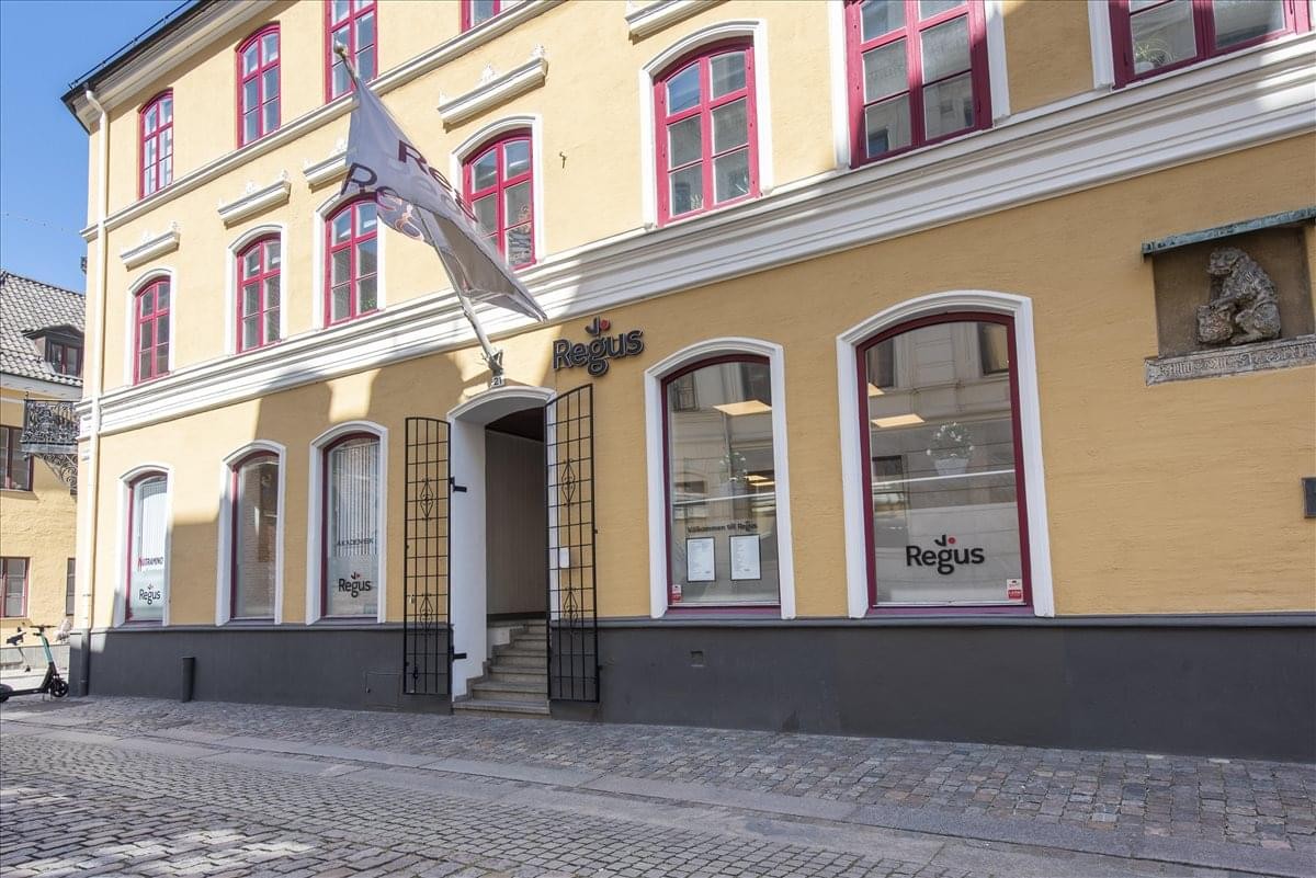 The classic yellow and white building facade at Adelgatan 21, Malmo, Sweden.