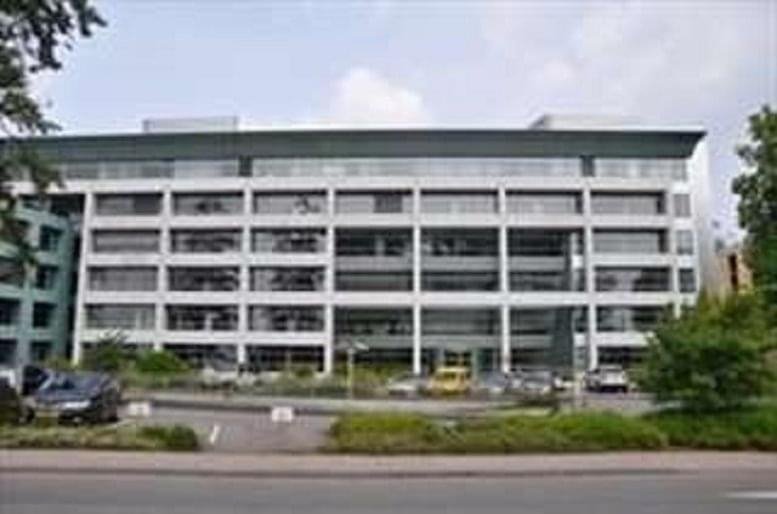 Exterior view of the Aerogolf building at 1B Heienhaff featuring a wide glass and white facade.