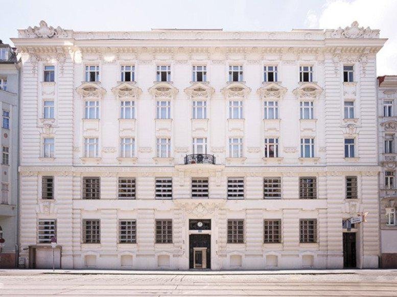 Exterior facade of the historic white Albertgasse 35, Vienna, Austria building with ornate carvings.