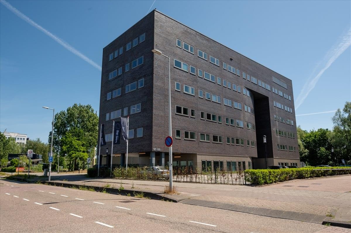Exterior view of the dark brick office building at Amstel Business Park.