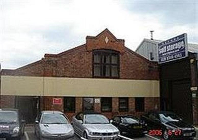 Exterior view of the brick-fronted industrial building at 24/26 Arcadia Avenue, Barnet.