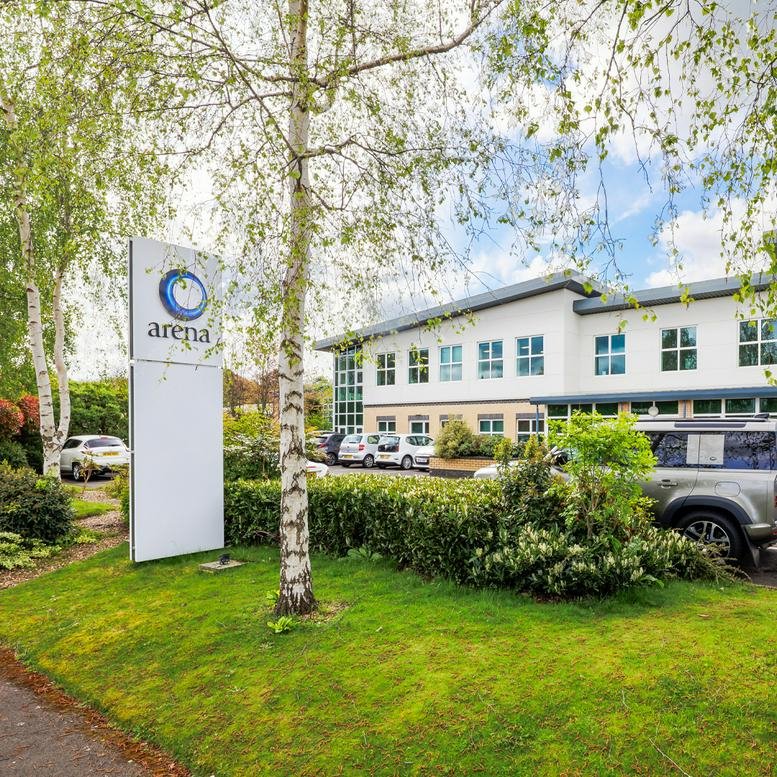 Exterior view of the modern white facade at Arena Business Centre, 9 Nimrod Way.