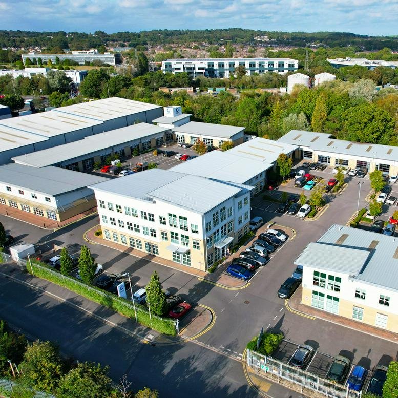 Aerial view of the Arena Business Centre, Holyrood Close, showing the modern office complex and parking.