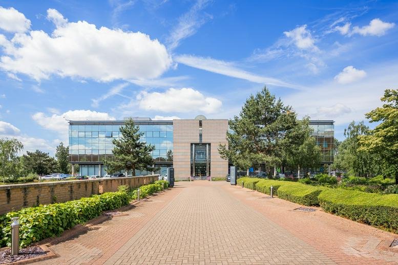 Exterior view of the modern glass-fronted Aztec West Centre, Aztec West, Almondsbury, Bristol.