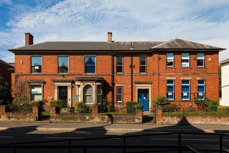 Exterior view of the red brick period facade at Babington Lodge, 128 Green Lane.