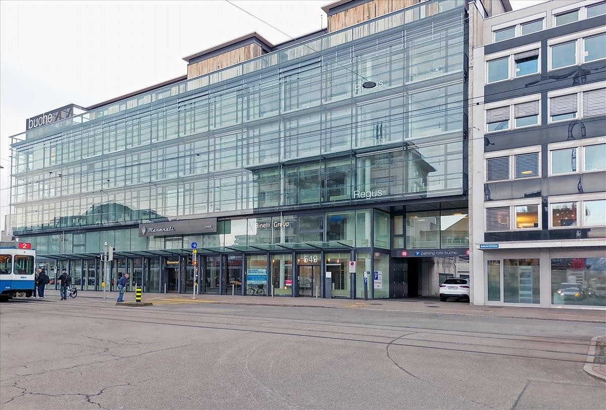Exterior view of the glass-facade building at Badenerstrasse 549, Zurich, Switzerland.