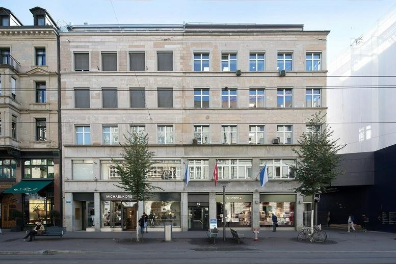 Classic stone facade and ground-floor retail of the Bahnhofstrasse 52, City Centre, Zurich, Switzerland building.