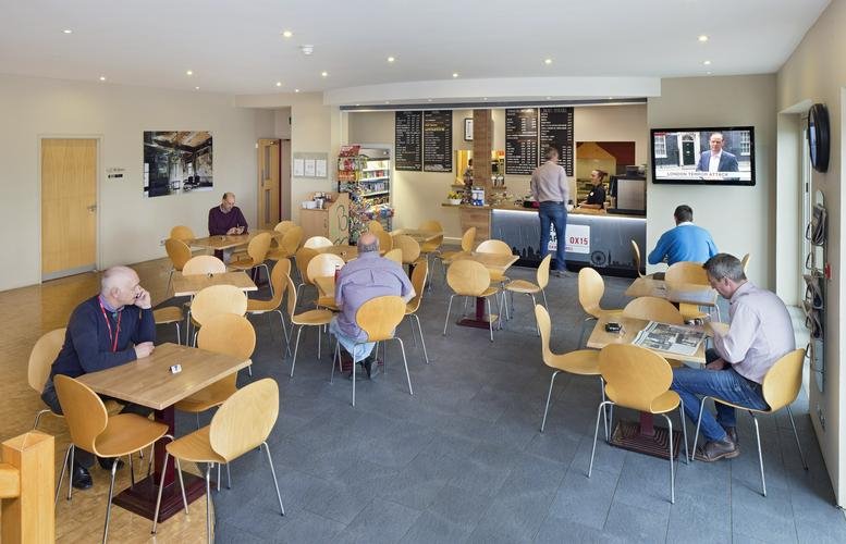 Spacious communal cafe at Barford Road, Banbury, Oxfordshire with ample seating and a service counter.