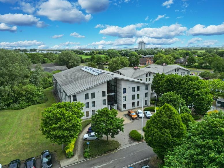 Exterior view of the modern grey facade of Belasis Business Centre, Belasis Hall Technogy Park.