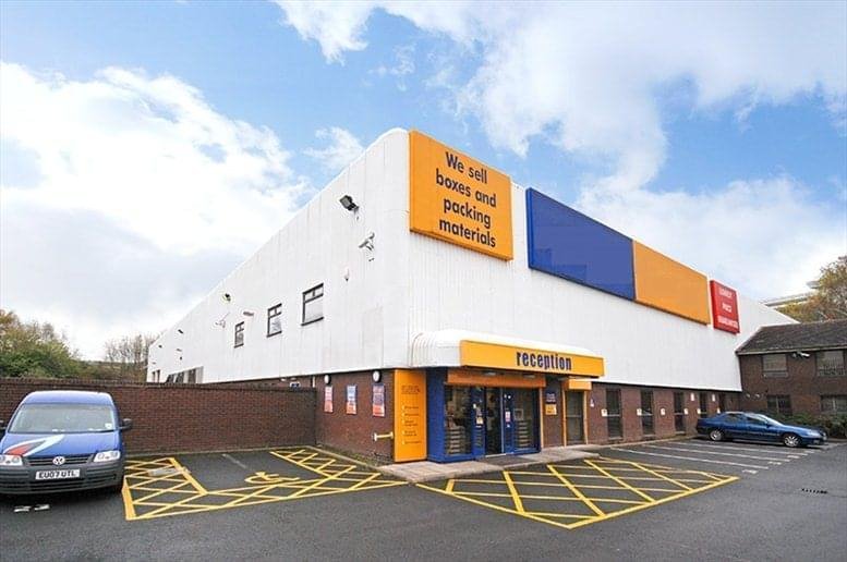 Exterior view of the white and orange Birchley Roundabout, Birchfield Lane building with parking area.