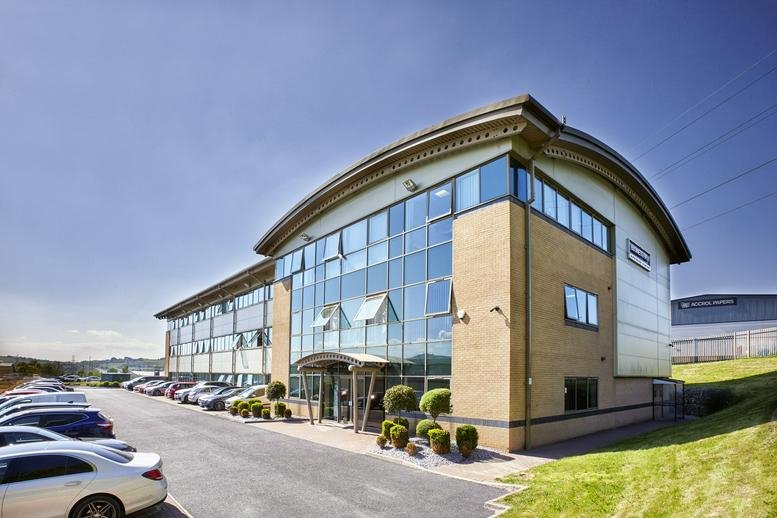 Exterior view of the curved glass facade of Blackburn Business Centre.