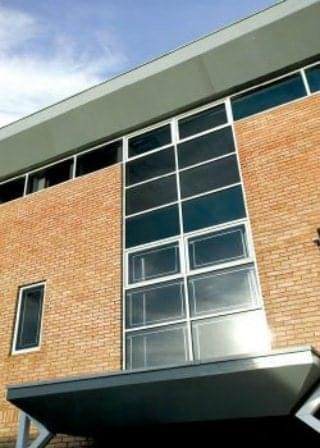 Exterior brick and glass facade of Blenheim Court, Brewery Road in London.