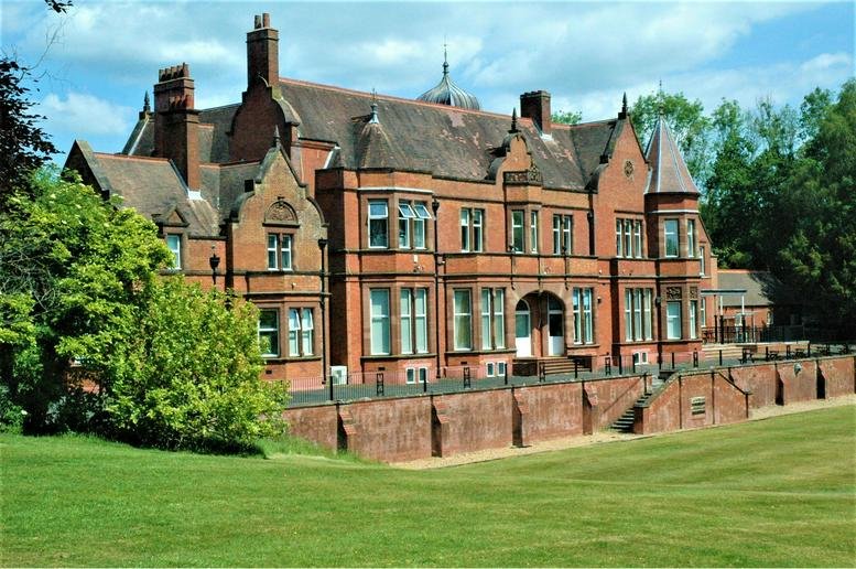 Exterior view of the historic red brick manor house at Bletchingley Road, Nutfield, Surrey.
