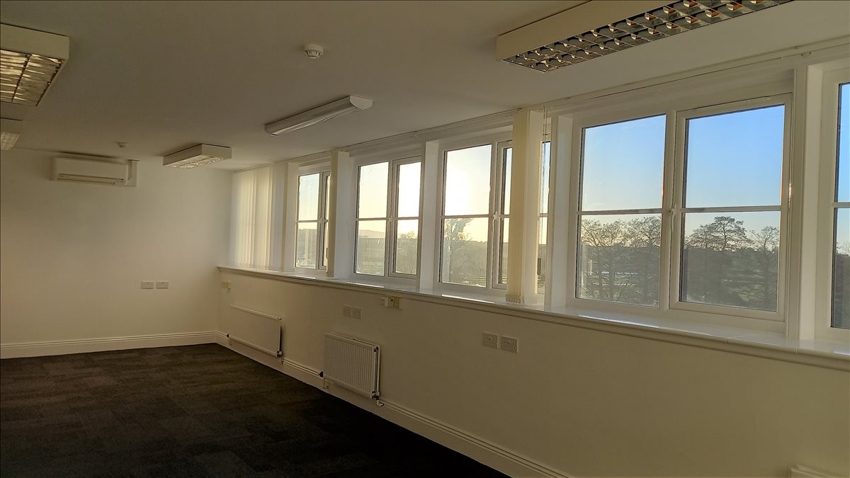 Spacious, bright open-plan workspace at Bond’s Mill Estate, Stonehouse, Stroud, Gloucestershire with large windows.