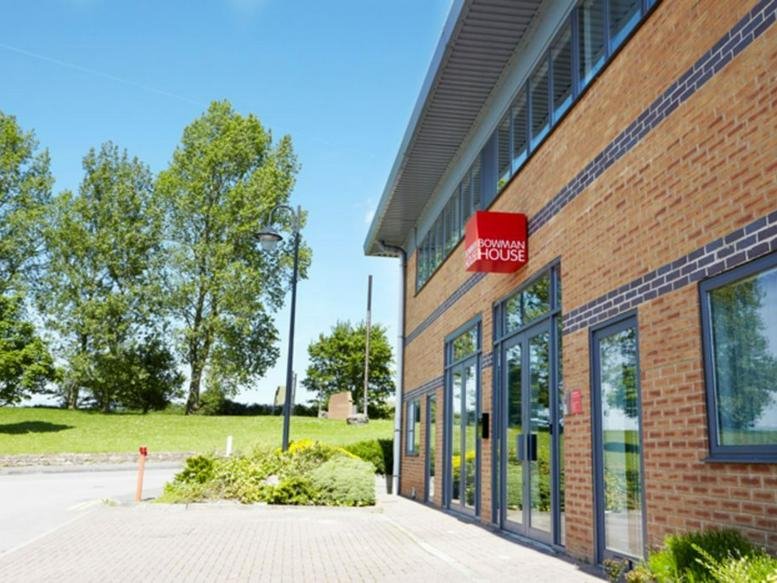 Exterior view of the brick facade and entrance at Bowman House Business Centre.