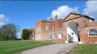 Exterior view of the historic red brick main building at Braxted Park Offices, Braxted Park Estate, Chelmsford.