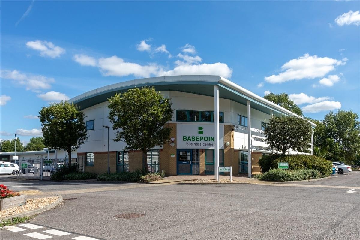The modern curved exterior of the Broadmarsh Business and Innovation Centre with blue skies.