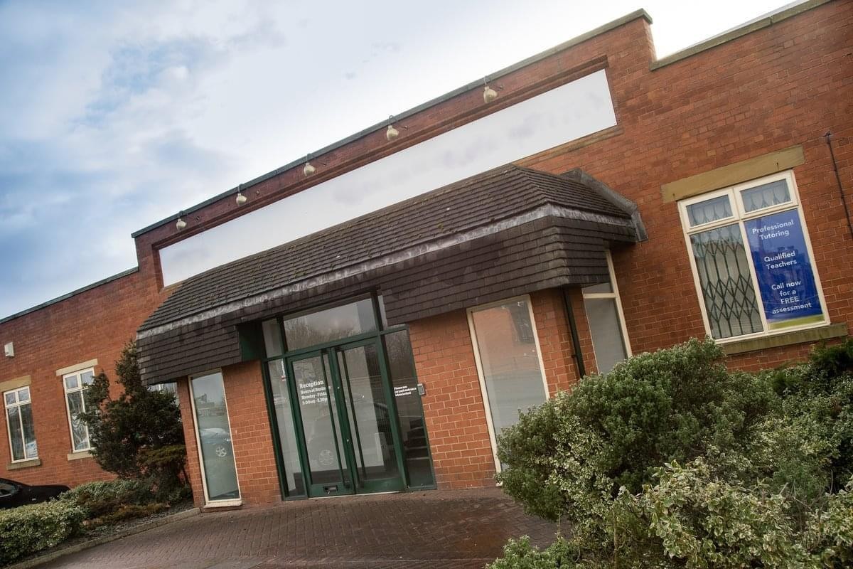 Brick exterior and main entrance of Brooklands Court, Tunstall Road.