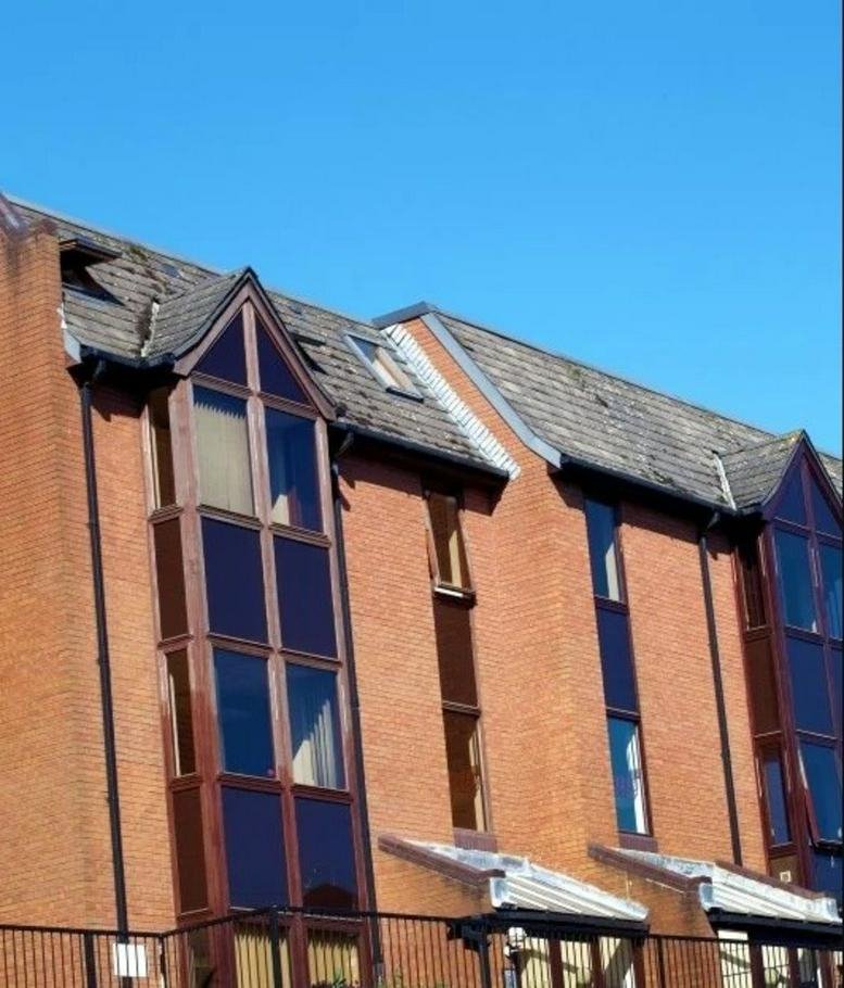 Exterior view of the brick facade at Buckingham Place, Bellfield Road West.