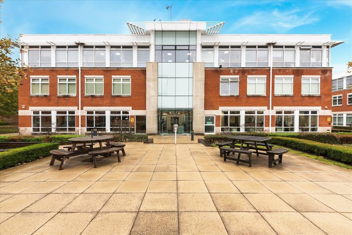 Exterior view of the red brick and glass facade at Building 1, Chalfont Park, Gerrards Cross.