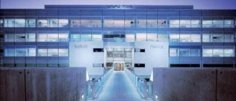 Exterior view of the modern glass-facade building at Calle Anabel Segura nº 11, Madrid, Spain.