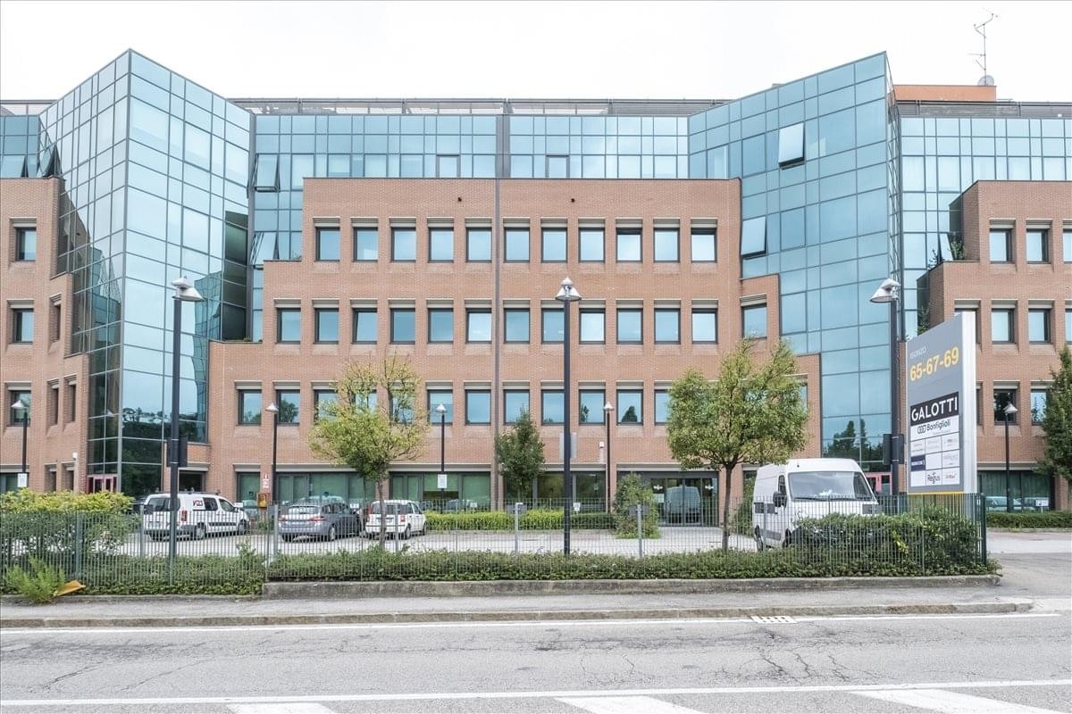Exterior view of the brick and glass office building at Casalecchio Meridiana, Via Isonzo 67.