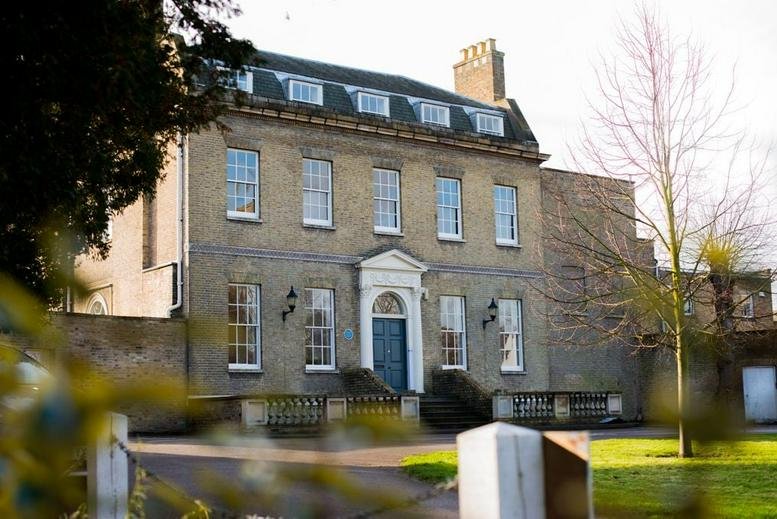 Exterior facade of Castle Hill House, 20 High Street, a grand Georgian-style brick building.