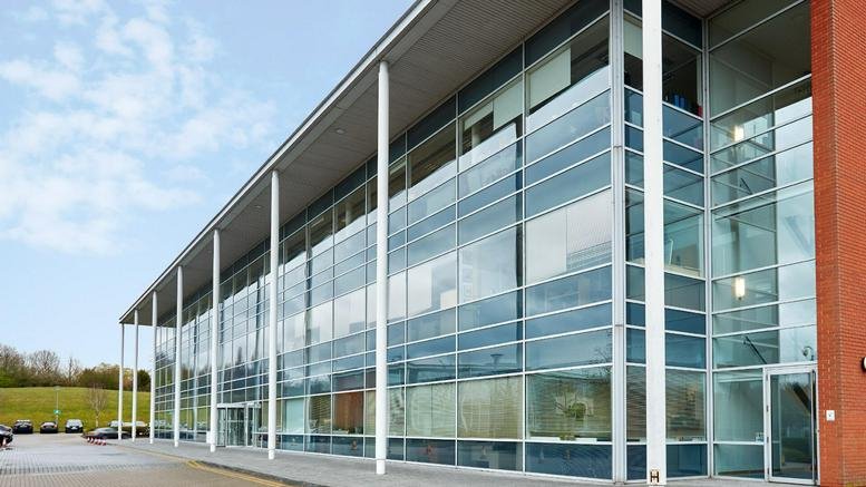 Exterior view of the glass-fronted Catalyst House building at 720 Centennial Court.