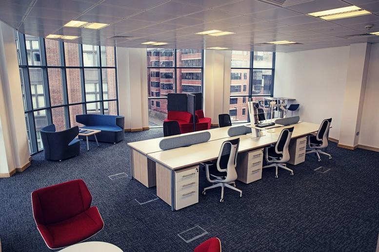 Spacious open-plan workspace at City Quadrant, Waterloo Square with desks and colourful lounge seating.