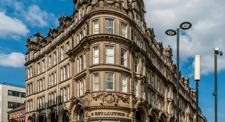 Exterior view of the historic grand stone facade at Collingwood Buildings.