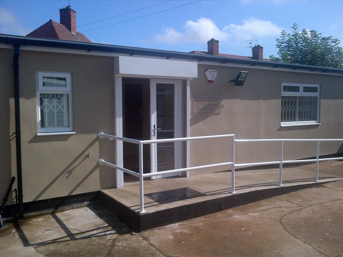 Exterior view of the Courtyard Business Centre, Southwold Drive, Nottingham with accessible ramp and glass doors.