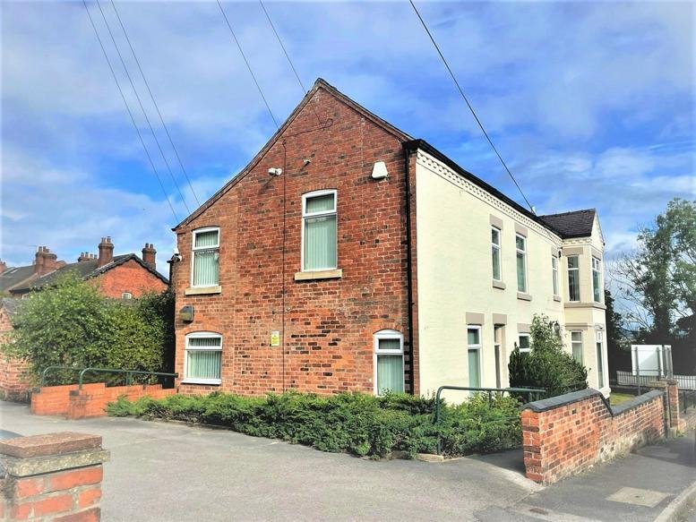 Exterior view of the brick and cream-rendered facade of Croft House, 51 Ashbourne Road, Derby.