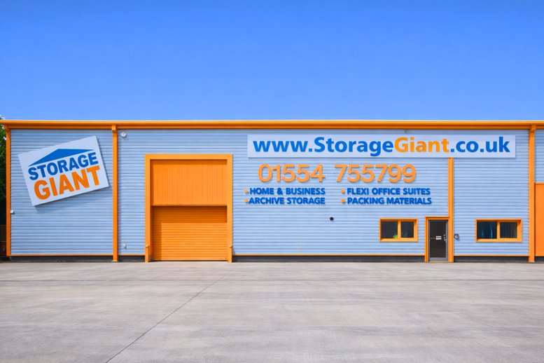Exterior view of the light blue and orange warehouse building at Llanelli Gate Business Park, Unit 11, Dafen.