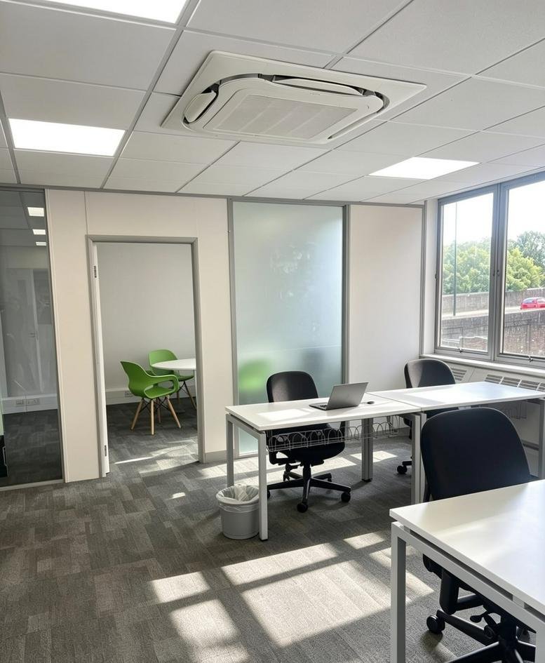Spacious open-plan workspace at Devonshire House, Elmfield Road, featuring multiple desks and natural light.