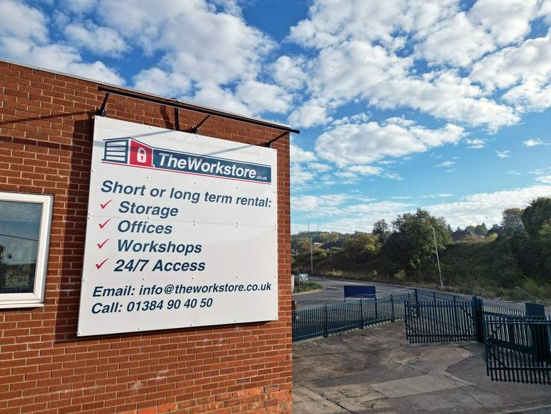 Exterior view of the brick building and main signage for The Workstore at Doulton Road.
