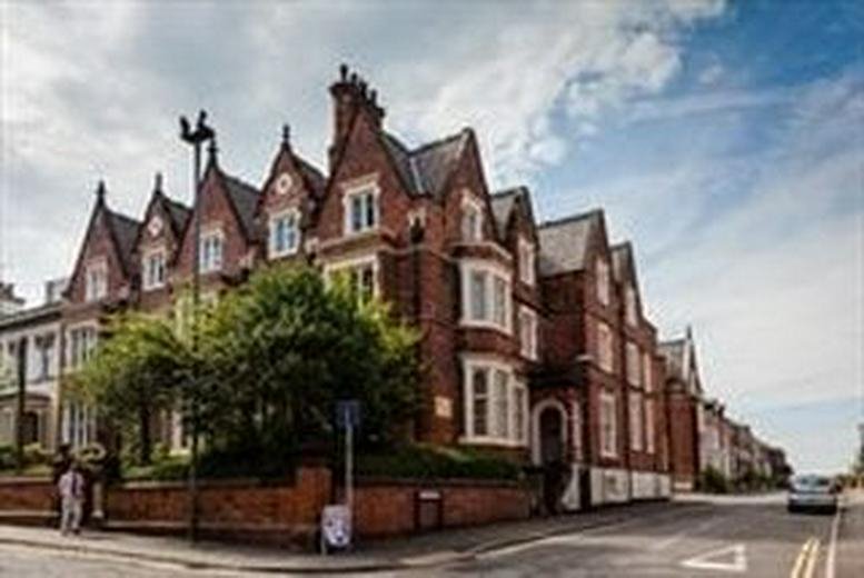 Exterior view of the historic red brick Dovedale House, 73 Wilson Street with gabled rooflines.