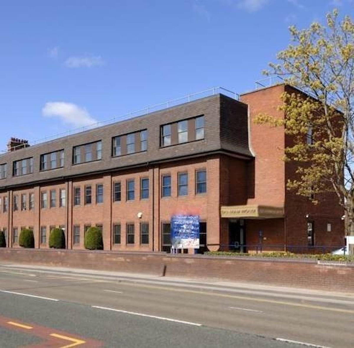 Exterior view of the brick facade at Dunham House, Washway Road.