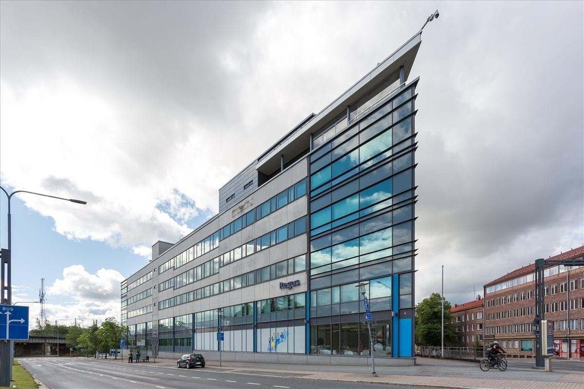 Exterior view of the triangular glass-facade Dynamo building at Hatanpään Valtatie 24.
