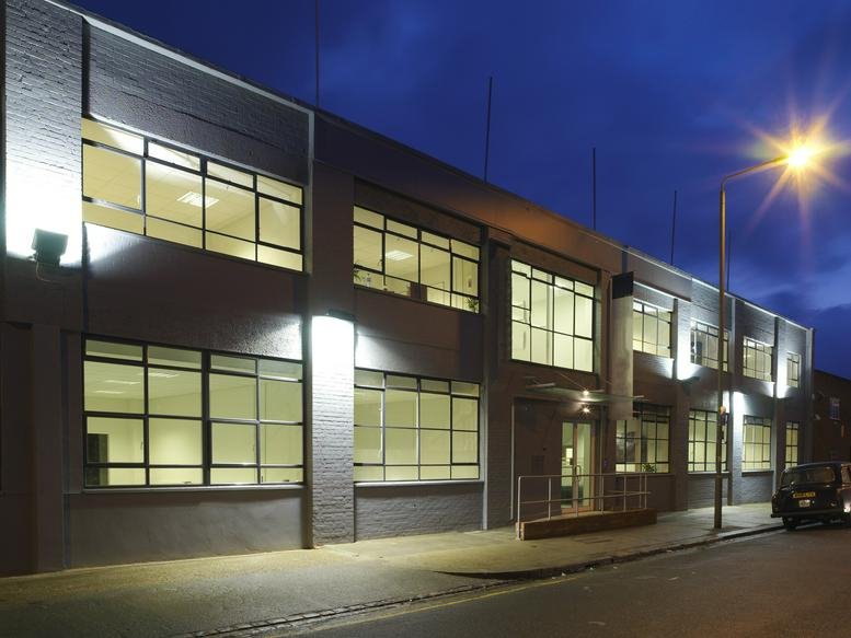 Exterior view of the low-rise Earlsfield Business Centre, 9 Lydden Road at dusk.