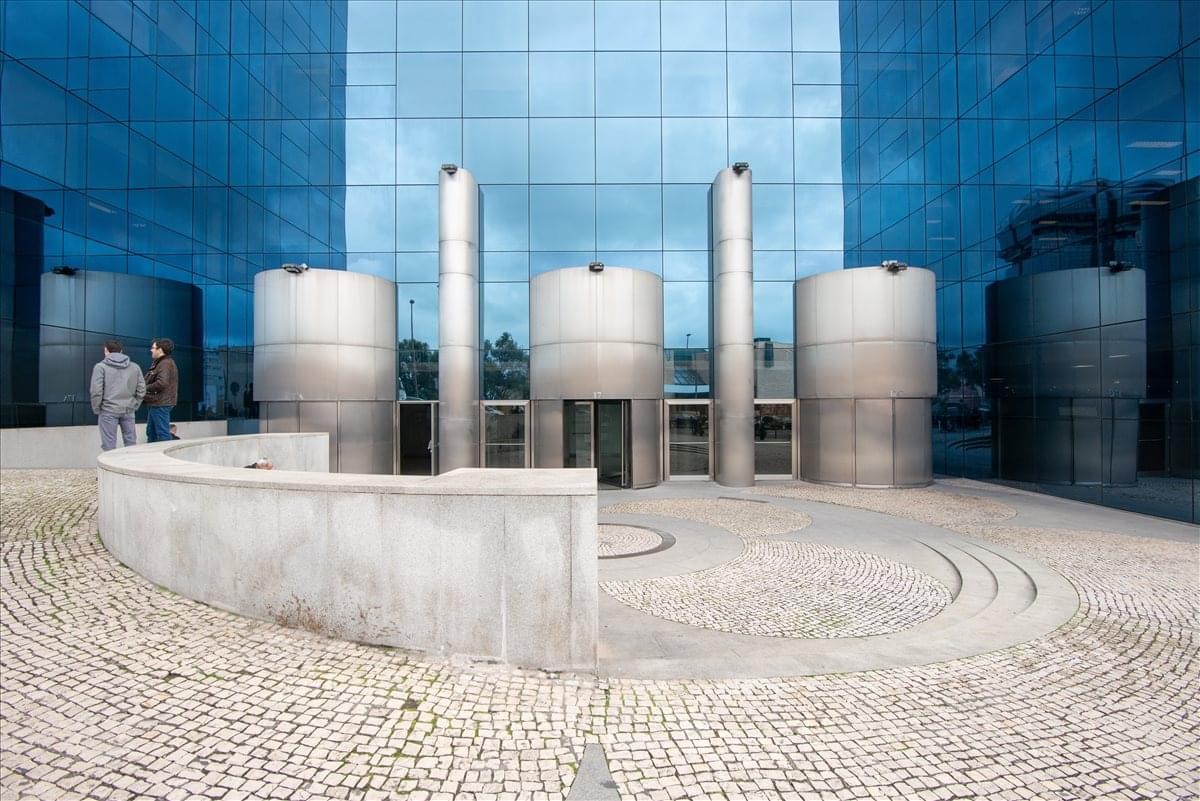 Exterior view of the blue glass and steel facade at Edifício Amoreiras Square.