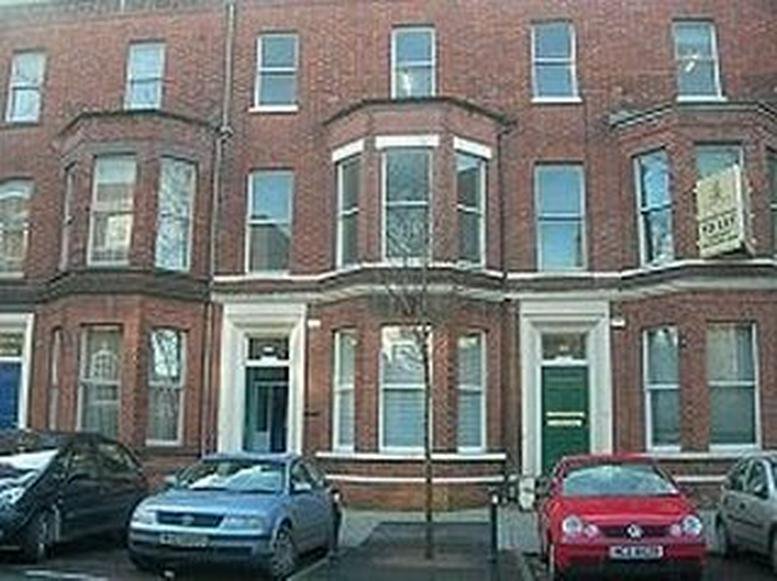 Exterior view of the red brick facade at Elmwood House, 44/46 Elmwood Avenue, Belfast.