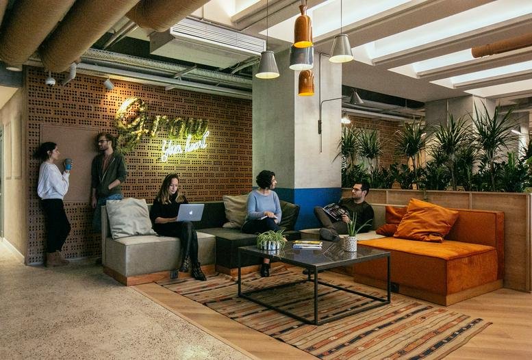 Lounge at Harman Sokağı No: 5, Esentepe, Levent, Sisli, Istanbul with brick walls and neon sign.