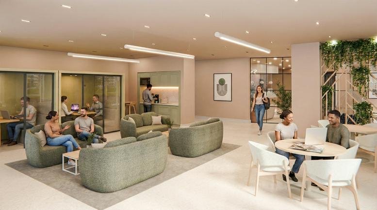 Spacious communal lounge with green sofas, white dining tables, and indoor plants.