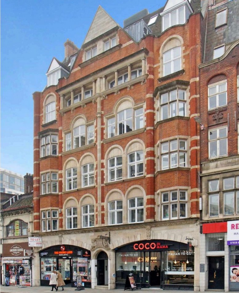 Exterior view of the red brick and stone facade of St Bartholomew House on Fleet Street.