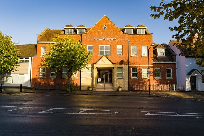 Wide view of Forward House on High Street showing the full brick building and neighboring architecture.
