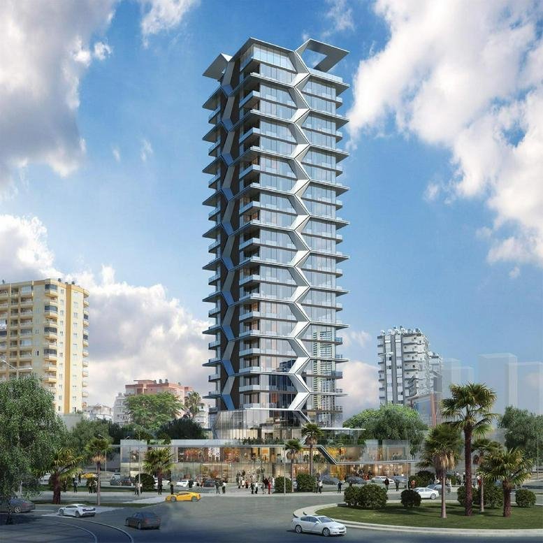 Exterior view of the modern high-rise at Ekinci Global İş Merkezi Sit. No: 5 featuring a unique geometric facade.